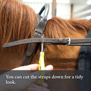 Showing how you can cut the straps down on the Correct Connect Double Neck Strap for a tidy look.